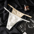A sleek, minimal view of the MemoSkin Smooth Low-Rise Men's Thong in black, showcasing its front profile. This thong underwear for men offers a seamless, invisible look under clothing, with soft, flexible side straps and a comfortable, low-rise cut. The smooth, breathable fabric and integrated cotton lining provide the perfect blend of comfort and style for discerning buyers looking for low-rise black men's thongs.