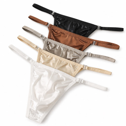 A top-down product photograph showcasing the full collection of MemoSkin Smooth Low-Rise Men's Thongs fanned out in five colors: White, Gray, Black, Apricot, and Brown. The thongs feature a minimalist design with narrow side straps and a smooth, flexible nylon-spandex blend fabric, designed for ultimate everyday comfort. This international men's underwear thong features a comfortable cotton lining and is available for global shipping.