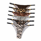 Full collection stack of MemoSkin Silky No-Show Briefs in 6 animal print patterns featuring Classic Leopard, Grey Leopard, Cheetah Print, Dark Leopard, Zebra Print, and Snow Leopard seamless low-rise underwear for women.